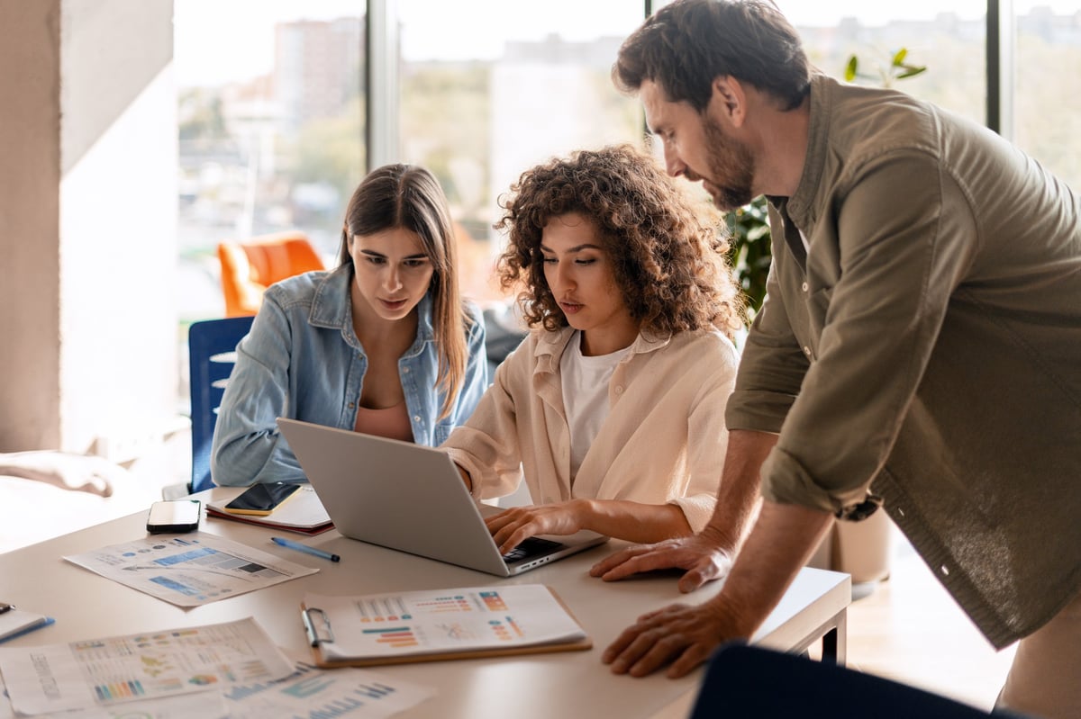 Marketing team collaborating in a bright modern office